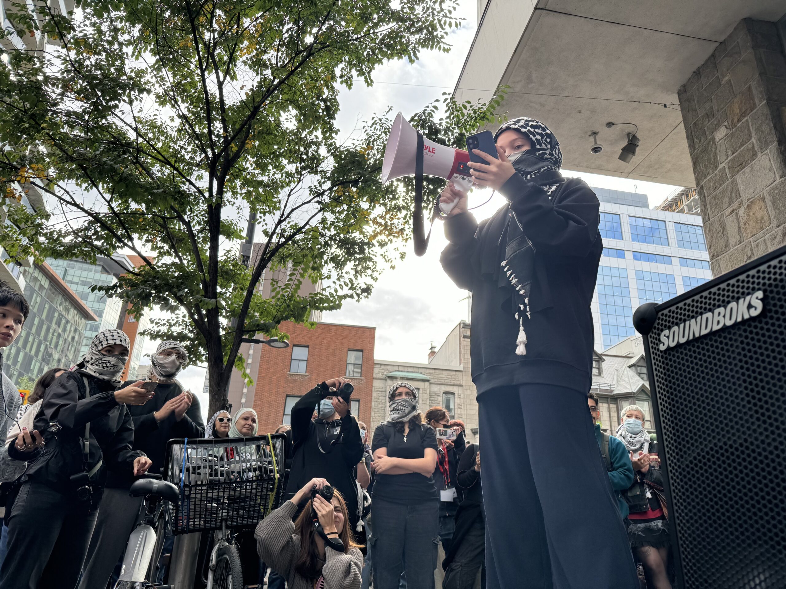 speaker wearing kuffiyeh